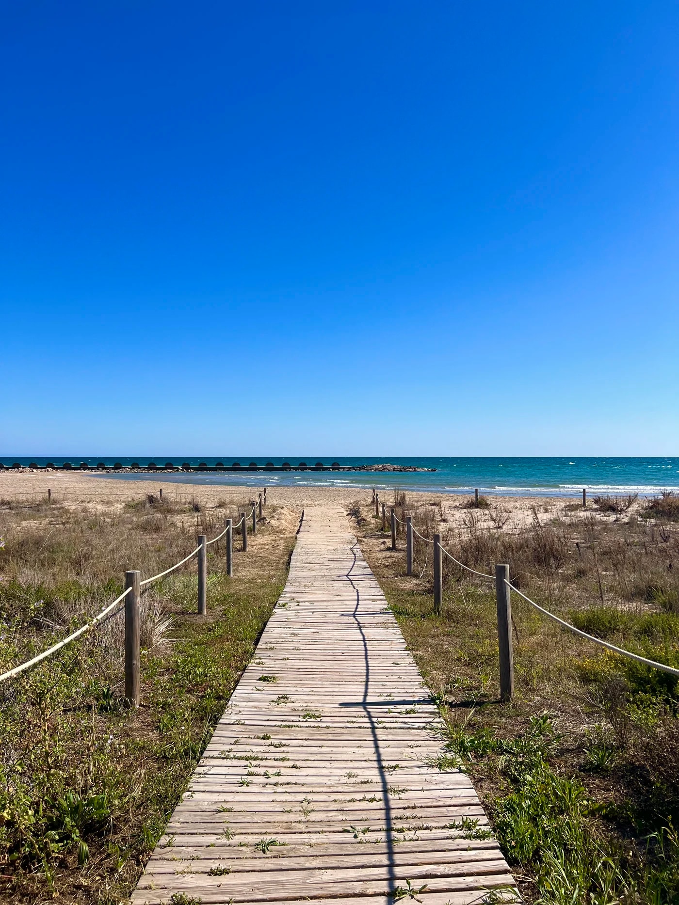 A boardwalk through the dunes to the beach near Cunit